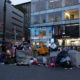 homeless: Clothes spread out in city gutter.