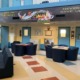 Connecticut turnaround of juvenile system sets standard: common area of juvenile facility with bright colors and motivational banner