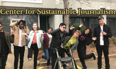 CSJ interns: Several young adults jumping in front of building