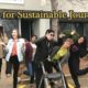 CSJ interns: Several young adults jumping in front of building