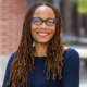 Dorothy Roberts: black woman with glasses and long hair standing outside