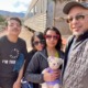 effects of pandemic school closure on students with disabilities: family stands next to train with daughter holding teddy bear