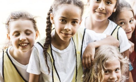 food access, community and environmental health grants: group of happy kids outdoors playing sports