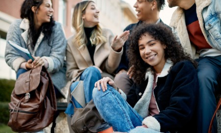 Fostering youth transitions 2023: group of happy students laughing and talking