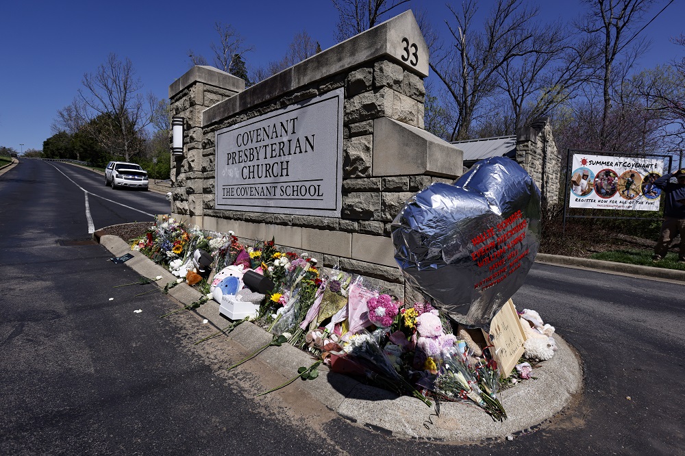 Funerals set for Nashville school shooting's 6 victims: entrance to church and school covered in memorial objects and balloon with names