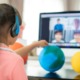 Asian girl student live learning video conference with teacher and other classmates giving presentation, showing solar model project