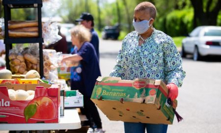 community nonprofit and food pantry support grants; members of church host a drive-up food pantry