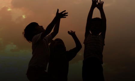 Innovative children's mental health program grants; image of children at sunset playing