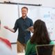 k-12 educator support grants: male teacher teaching students in classroom