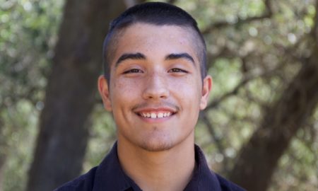 native youth grants: smiling young man in front of natural background