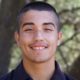 native youth grants: smiling young man in front of natural background