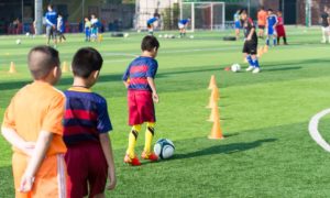 youth sports access grants: children practicing soccer