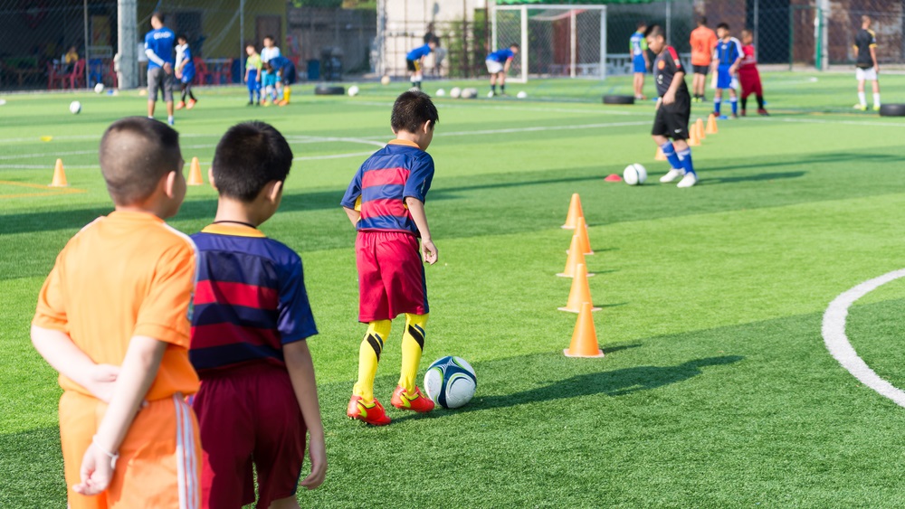 youth sports access grants: children practicing soccer