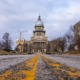 Illinois budget worsened foster care crisis: view of Illinois state capitol from rough road leading up to it.