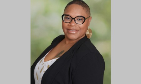 Kimberly R Alexander executive director of MOBB United: black woman with short hair and glasses smiling in blazer