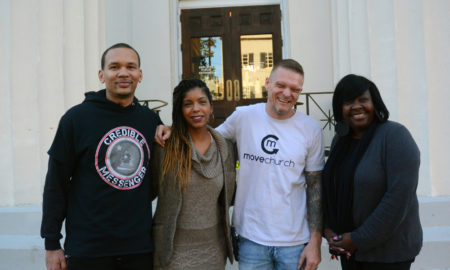 gun violence: 2 men and 2 women, all smiling, stand in front of building.