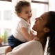 child health, maternal health grants: young black mother and child smiling and laughing