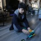 New York pilot dyslexia program: boy plays with legos on floor of home with parent in background