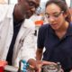 apprenticeship: Engineer showing equipment to a female apprentice