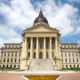 Kansas law reading skills: Kansas State Capitol builing traditional architecture cream-colored with dome centertop