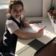 Some disabled students and parents want remote learning permanent option: little girl doing school work at home desk with tablet