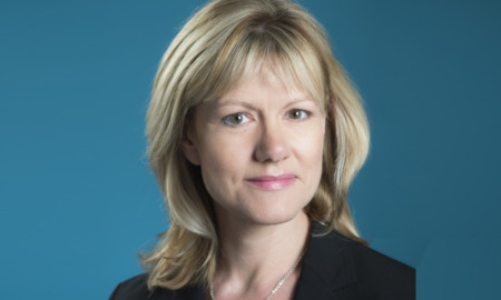 Afterschool researcher: Jennifer McComgs headshot blond lady wearing navy suit