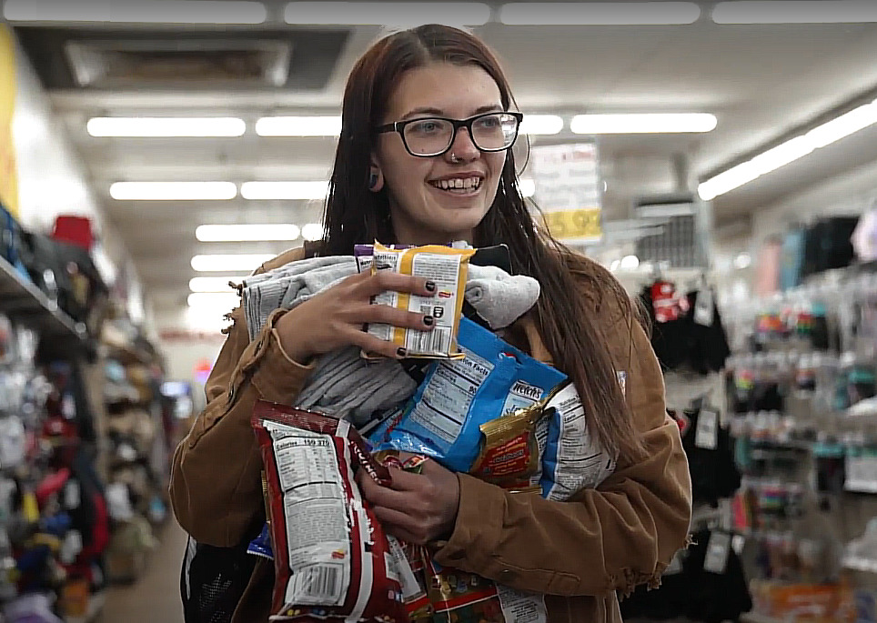 Homeless New Mexico youth: Young lady with long, dark hair wearing glasses