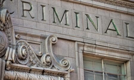 FL juvenile justice: Exterior of ornate, older building with word "criminal" etched in stone.