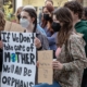 Climate change series: Young people hold protest signs