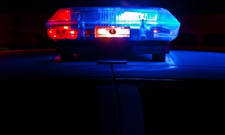 Police and Foster Care: Close-up of red and blue light on top of car roof