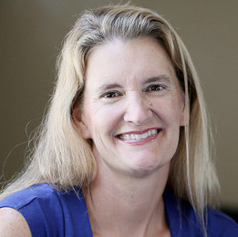 Teen survey depression: Headshot smiling woman with long blonde hair in blue top.