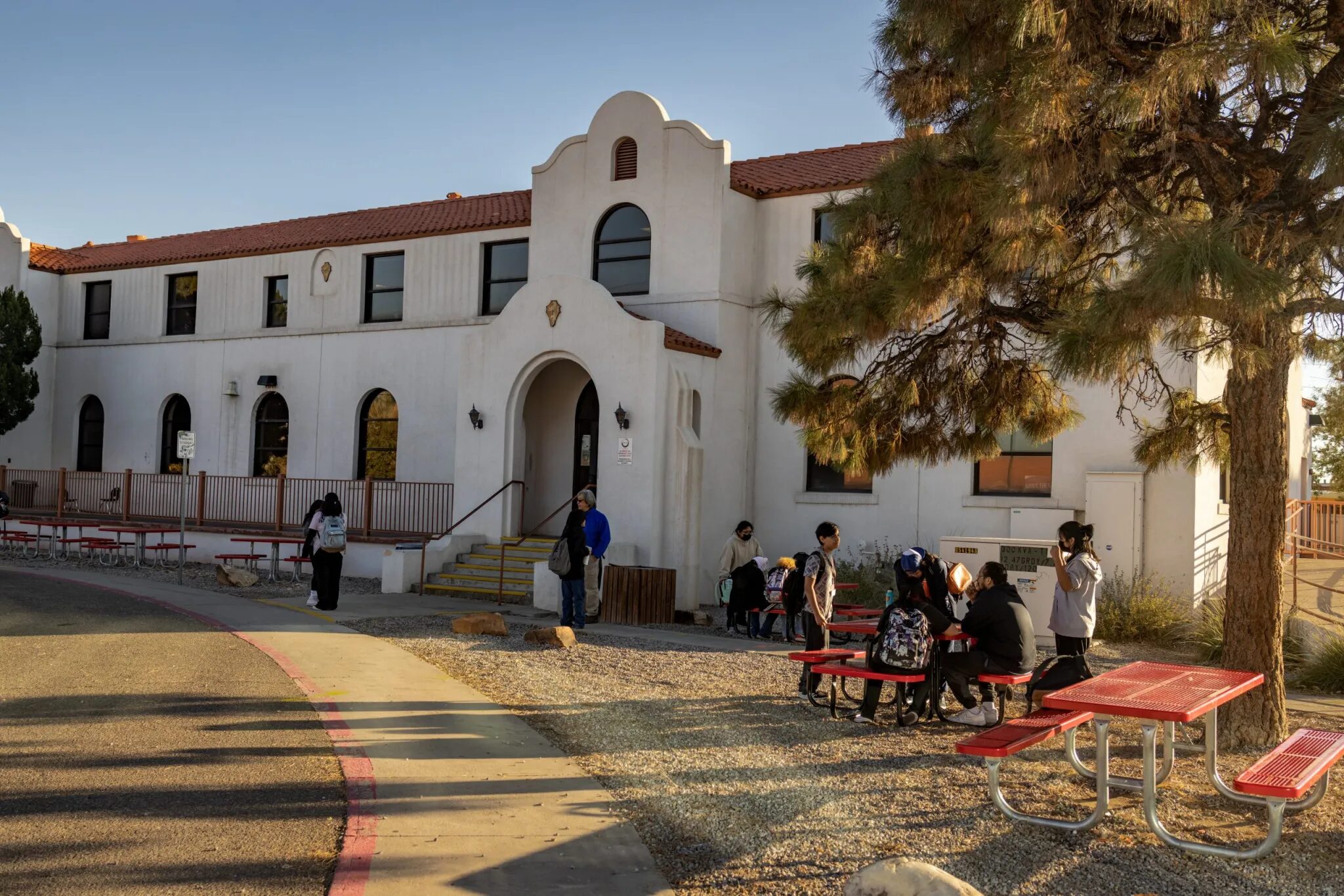 Native American charter schools: Adobe Spanish style off-white, 2-story large building