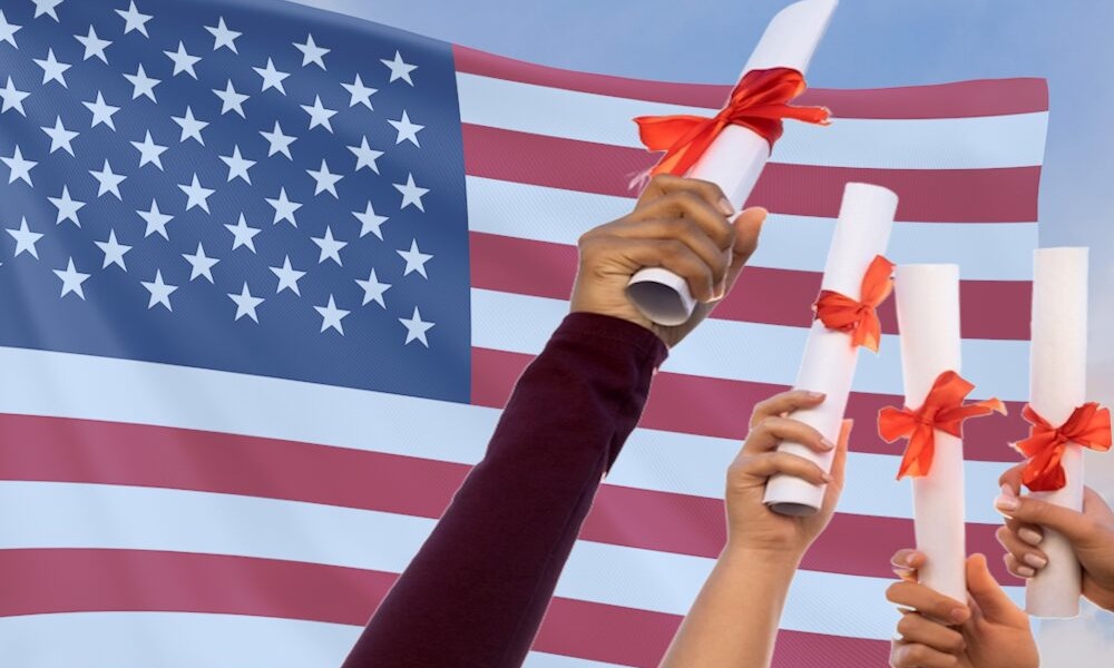 Older Immigrant student school admissions: 5 outstretched arms with hands holding rolled-up document tied with red ribbon against background of American flag