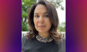 Nicole Rodriguez Leach named executive director of Grantmakers for Education: woman with medium length dark hair and and dark shirt outside