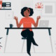 School mindfulness: Brown-skinned woman with curly black hair in black slacks and peach top sits behind table with laptop, eyes closed, elbows on desk and fingers of each hand forming a circle