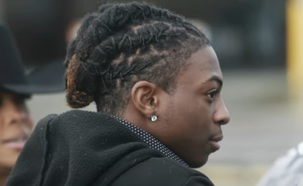 Texas Black haur ruling: Closeup profile of Darryl George, a Black teenager with long Black locs worn tied up close to his head