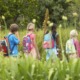 outdoor learning grant: teacher and students in backpacks out in nature