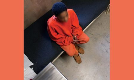 color of youth in adult justice system report; young black teen in jail cell