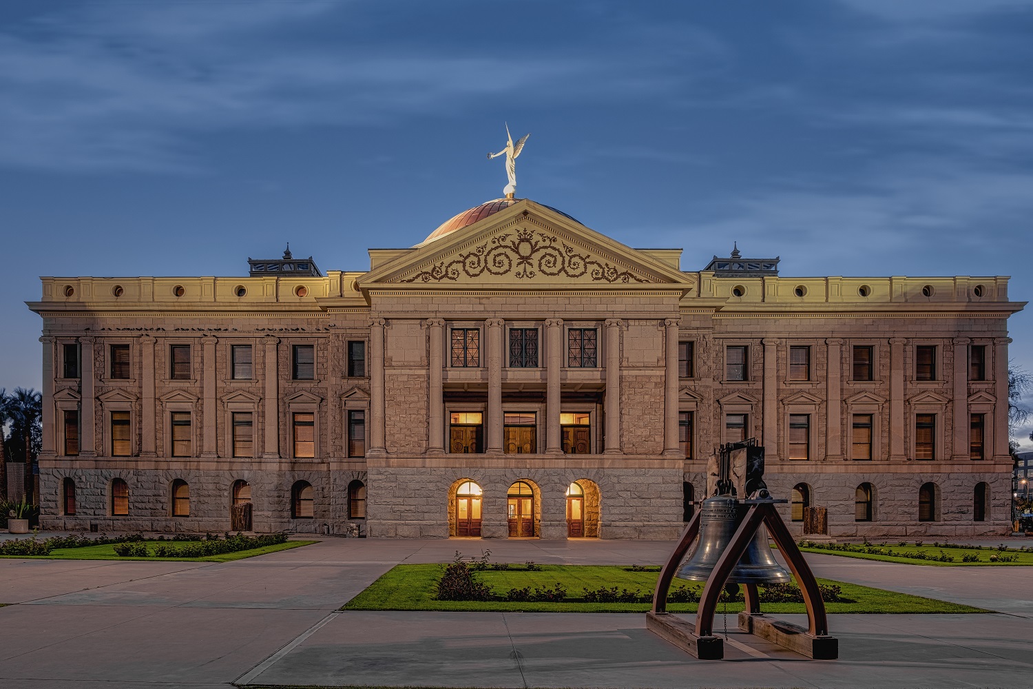 School vouchers supposed to save money, instead blew massive hole in Arizona budget: view of Arizona's state capitol building at dusk or dawn