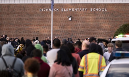 shooting fallout, metal detectors in schools: people gather outside elementary school that was site of school shooting by 6-year old