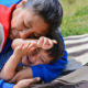 Tender portrait of native american woman with her little son