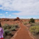 Native American: A child walking down a path to view ruins.