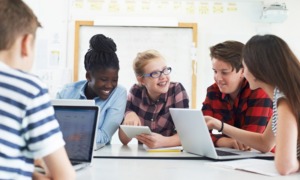 post-pandemic federal afterschool funds disappear: group of young students working together on project