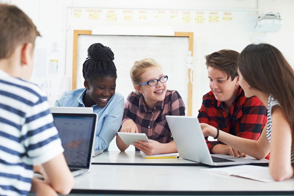 post-pandemic federal afterschool funds disappear: group of young students working together on project