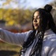 Students turn to TikTok to fill gaps in school lessons: black girl with long hair takes a selfie on phone outside