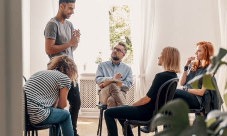 Substance abuse treatment, diversion: group of young people and counselor doing group therapy