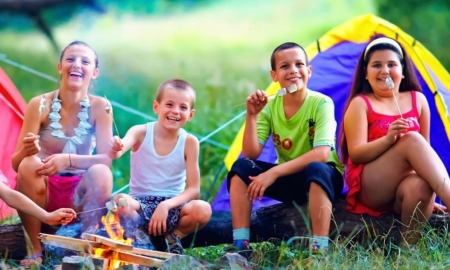 West Michigan child and youth program grants: group of happy kids at campsite