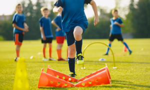 youth athlete safety, preventing youth sports injuries grants; young children practicing on field