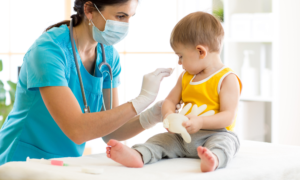 Child health, Community-Based Child Healthcare Access grant; doctor helping young child patient