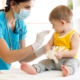 Child health, Community-Based Child Healthcare Access grant; doctor helping young child patient